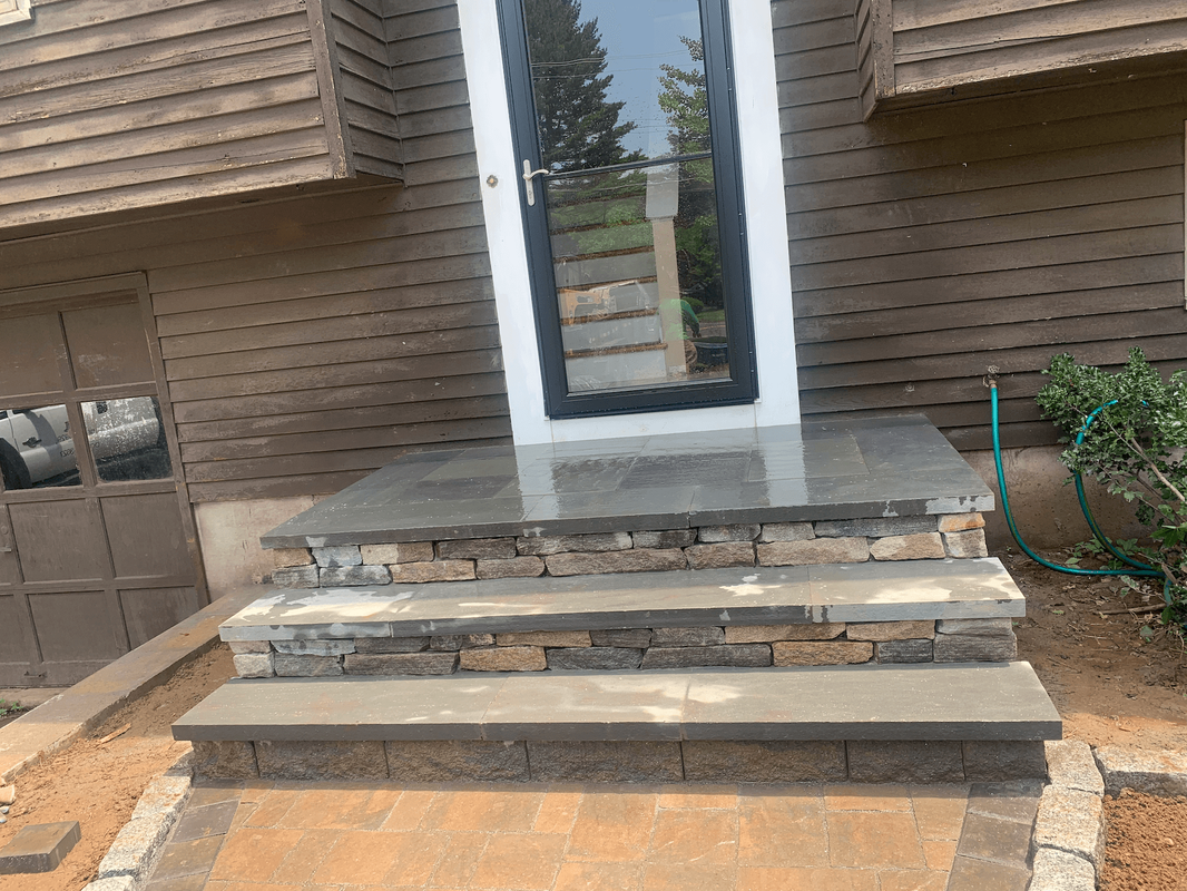 Porch steps with decorative stone inlay